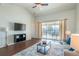 Living room featuring vaulted ceilings, hardwood floors and modern decor at 4410 Sw 52Nd Cir # 108, Ocala, FL 34474