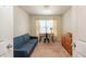 Cozy office space featuring a desk, sofa, dresser and ample natural lighting at 4410 Sw 52Nd Cir # 108, Ocala, FL 34474