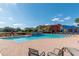 Beautiful community pool with stone waterfall feature and comfortable seating areas for residents at 4410 Sw 52Nd Cir # 108, Ocala, FL 34474