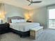 Calm bedroom featuring a queen bed, neutral decor, carpet flooring, and access to a balcony at 3370 Ocean Shore Blvd # 5020, Ormond Beach, FL 32176