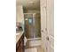 Bathroom featuring a glass-enclosed shower with tile surround at 5108 Caspian St, St Cloud, FL 34771