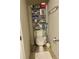 Efficient half-bathroom with storage shelves at 5108 Caspian St, St Cloud, FL 34771