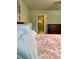 Bedroom with view of bathroom with tiled shower and neutral walls at 5108 Caspian St, St Cloud, FL 34771