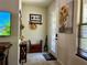 Inviting entryway featuring decorative accents, functional bench seating, and abundant natural light through the window at 5108 Caspian St, St Cloud, FL 34771