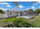 View of the backyard with a screened in pool and green lawn in the backyard at 14867 Bonnybridge Dr, Orlando, FL 32826