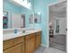 Well-lit bathroom featuring a spacious vanity, neutral walls, and tile floors at 14867 Bonnybridge Dr, Orlando, FL 32826