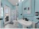 Bathroom featuring a blue painted walls, white fixtures, and a shower with a floral curtain at 14867 Bonnybridge Dr, Orlando, FL 32826