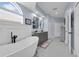 A luxurious bathroom showcasing a soaking tub, double vanity, and recessed lighting at 14867 Bonnybridge Dr, Orlando, FL 32826