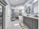 Beautifully remodeled bathroom featuring double vanity, soaking tub, and glass enclosed shower at 14867 Bonnybridge Dr, Orlando, FL 32826