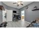 A bright and airy bedroom featuring a desk area, couch, and neutral decor at 14867 Bonnybridge Dr, Orlando, FL 32826