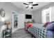 Bedroom with a ceiling fan, a window, and hardwood floors at 14867 Bonnybridge Dr, Orlando, FL 32826