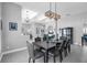 Elegant dining room features modern light fixture and stylish decor, perfect for entertaining guests at 14867 Bonnybridge Dr, Orlando, FL 32826