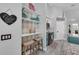 Charming kitchen with open shelving, decorative accents, and cozy breakfast bar area at 14867 Bonnybridge Dr, Orlando, FL 32826