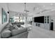 Spacious living room with a large sectional, ceiling fan, and built in cabinets and drawers at 14867 Bonnybridge Dr, Orlando, FL 32826