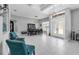 Bright, open layout featuring tile floors, modern furnishings, tray ceilings, and recessed lights at 14867 Bonnybridge Dr, Orlando, FL 32826