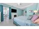 Comfortable bedroom offers tile flooring, an electric fireplace, and a screened patio at 14867 Bonnybridge Dr, Orlando, FL 32826