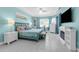 Bright bedroom featuring large windows, a ceiling fan, and en-suite bathroom access at 14867 Bonnybridge Dr, Orlando, FL 32826