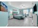 Serene bedroom features a tray ceiling, tile floor, and abundant natural light at 14867 Bonnybridge Dr, Orlando, FL 32826