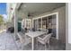 A charming outdoor patio with wicker furniture, perfect for relaxing and entertaining at 14867 Bonnybridge Dr, Orlando, FL 32826