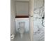 This bathroom features a modern toilet next to a shower with marble-patterned tiles at 3295 Se 56Th Ave, Ocala, FL 34480