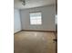 Minimalist bedroom with neutral carpet, natural light through a window at 3295 Se 56Th Ave, Ocala, FL 34480