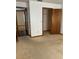 Bedroom with carpeted floors and an open closet showing the potential for organization at 3295 Se 56Th Ave, Ocala, FL 34480