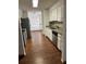 A kitchen showcases modern appliances, granite countertops, and white cabinetry at 3295 Se 56Th Ave, Ocala, FL 34480