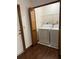 A laundry room includes a washer, dryer, and wire shelving for organization at 3295 Se 56Th Ave, Ocala, FL 34480
