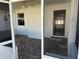 The screened porch features tile flooring, and ample light, ideal for relaxing or entertaining at 3295 Se 56Th Ave, Ocala, FL 34480