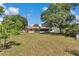 The home is surrounded by mature trees with a large yard at 8082 Sw 103Rd Ln, Ocala, FL 34481