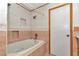 This bathroom features a tub with jets and unique tile accents at 8082 Sw 103Rd Ln, Ocala, FL 34481