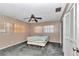 Bedroom featuring a ceiling fan, natural light, and a spacious closet for storage at 8082 Sw 103Rd Ln, Ocala, FL 34481