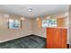 Cozy bedroom featuring two windows and green carpet at 8082 Sw 103Rd Ln, Ocala, FL 34481