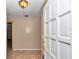 Bright foyer featuring tile flooring and a view of the front door, creating a welcoming entrance at 8082 Sw 103Rd Ln, Ocala, FL 34481