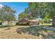 A well-manicured front yard with lush landscaping surrounding a charming home at 8082 Sw 103Rd Ln, Ocala, FL 34481