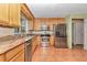 Bright kitchen with stainless steel appliances and granite countertops provides ample space and function at 8082 Sw 103Rd Ln, Ocala, FL 34481