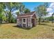 This large shed is in the backyard at 8082 Sw 103Rd Ln, Ocala, FL 34481
