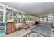Enclosed sunroom featuring windows to let in the outside greenery at 8082 Sw 103Rd Ln, Ocala, FL 34481