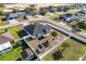 Aerial view of a fenced backyard with a shed and palm tree in a residential community at 9945 Sw 55Th Avenue Rd, Ocala, FL 34476