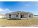 Spacious backyard featuring a covered patio, perfect for outdoor dining and relaxation at 9945 Sw 55Th Avenue Rd, Ocala, FL 34476