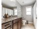 Bathroom with walk-in shower, single vanity and ample natural light at 9945 Sw 55Th Avenue Rd, Ocala, FL 34476