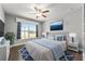 Stylishly decorated bedroom with a large window and a comfortable bed for restful sleep at 9945 Sw 55Th Avenue Rd, Ocala, FL 34476