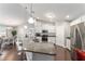 Spacious kitchen with stainless steel appliances and granite countertops, open to dining area at 9945 Sw 55Th Avenue Rd, Ocala, FL 34476