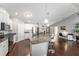 Open concept kitchen with stainless steel appliances and a large island with bar seating at 9945 Sw 55Th Avenue Rd, Ocala, FL 34476