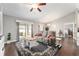 Cozy living room with sliding glass doors to the patio and views into a bedroom at 9945 Sw 55Th Avenue Rd, Ocala, FL 34476