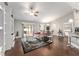 Bright living space features wood floors, open to dining and kitchen, with a sliding glass door to the patio at 9945 Sw 55Th Avenue Rd, Ocala, FL 34476