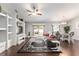 Bright living space features wood floors, open to dining and kitchen, with a sliding glass door to the patio at 9945 Sw 55Th Avenue Rd, Ocala, FL 34476