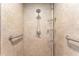Detail of shower with grab bars and shower head and tile at 9945 Sw 55Th Avenue Rd, Ocala, FL 34476