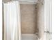 Updated shower with tiled walls and modern fixtures showcases a clean and functional space at 9945 Sw 55Th Avenue Rd, Ocala, FL 34476