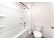 Bright bathroom features a shower and a toilet at 6683 Se 3Rd Loop, Ocala, FL 34472